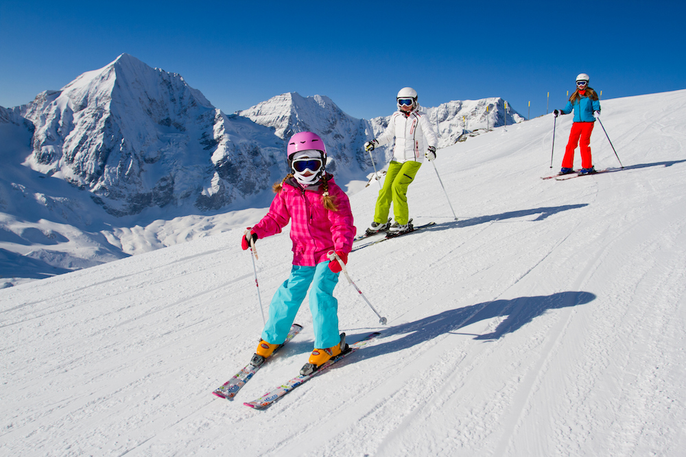 family skiing in aspen